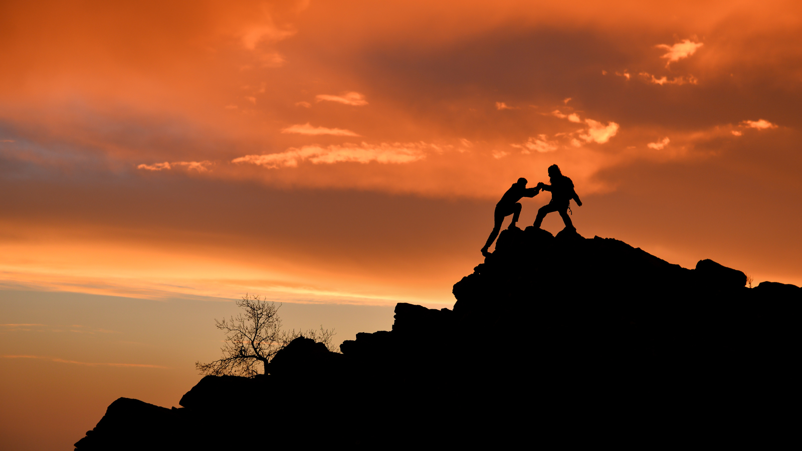 two people climb mountain