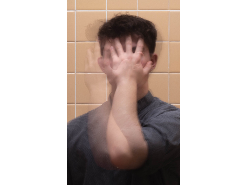 Blurred man standing in bathroom