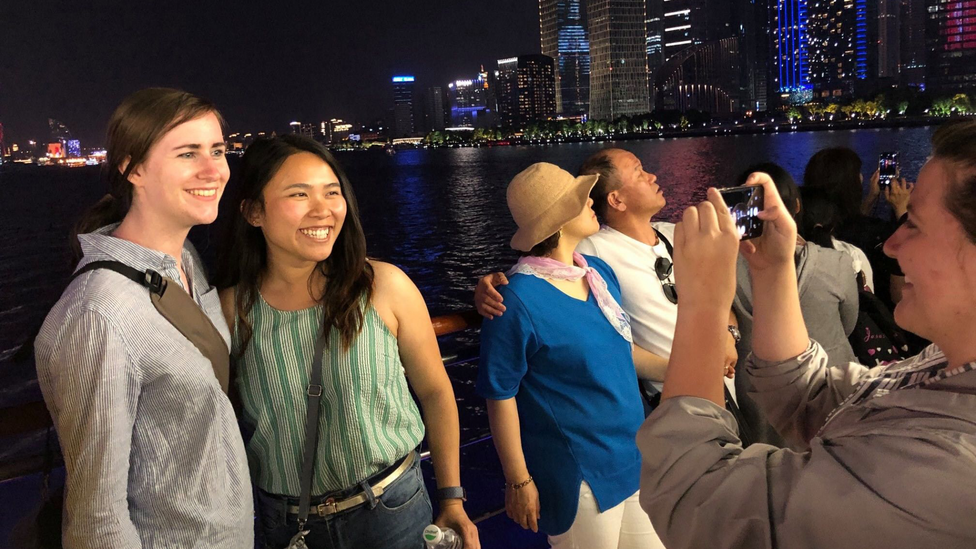students in front of Shanghai skyline