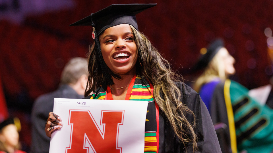 A College of Journalism and Mass Communications student graduates with their bachelors of journalism at Pinnacle Bank Arena.