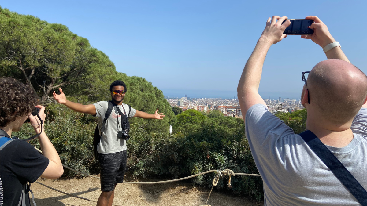Students taking photos of classmate in Spain