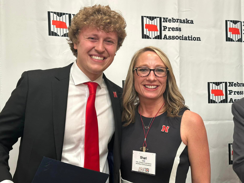 Jacob Vanderford (left) with Shari Veil, dean of the College of Journalism and Mass Communications, is pictured at the NPA convention on April 15. 