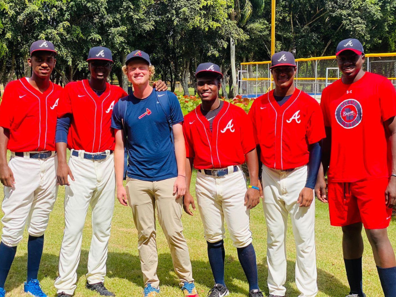 Ryan Taylor poses with the Atlanta Braves' minor league team. Taylor, a former CoJMC graduate from the University of Nebraska-Lincoln, scouts baseball prospects in the Dominican Republic and joined the Braves in 2020.