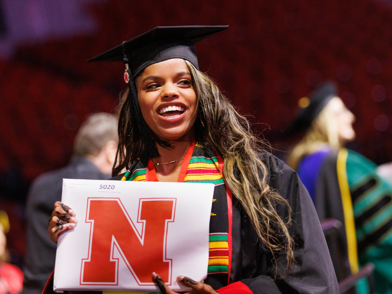 A College of Journalism and Mass Communications student graduates with their bachelors of journalism at Pinnacle Bank Arena.