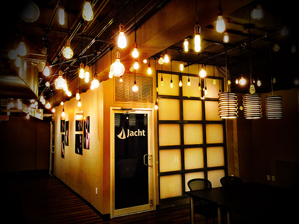 Jacht Ad Lab's door surrounded by hanging lights