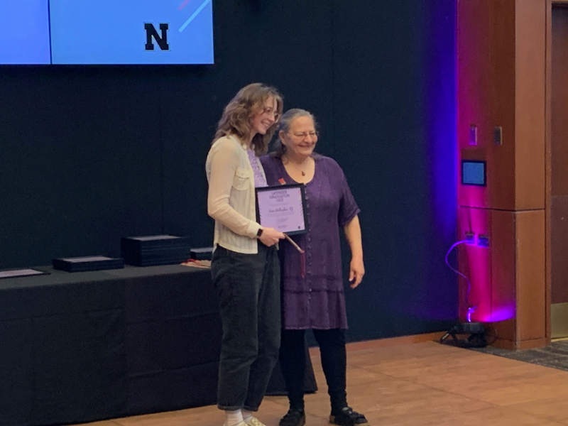 Anne Gallagher is presented a Lavendar Graduation certificate by Pat Tetreault, director of the UNL LGBTQA+ Center and UNL Women’s Center on May 4. 2023. 