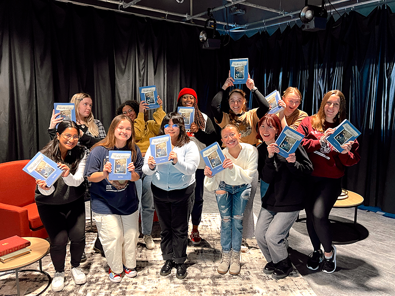 Students in the Nebraska Mosaic class pose with copies of World Citizen: Journeys of a Humanitarian gifts to them by Jane Olson. 