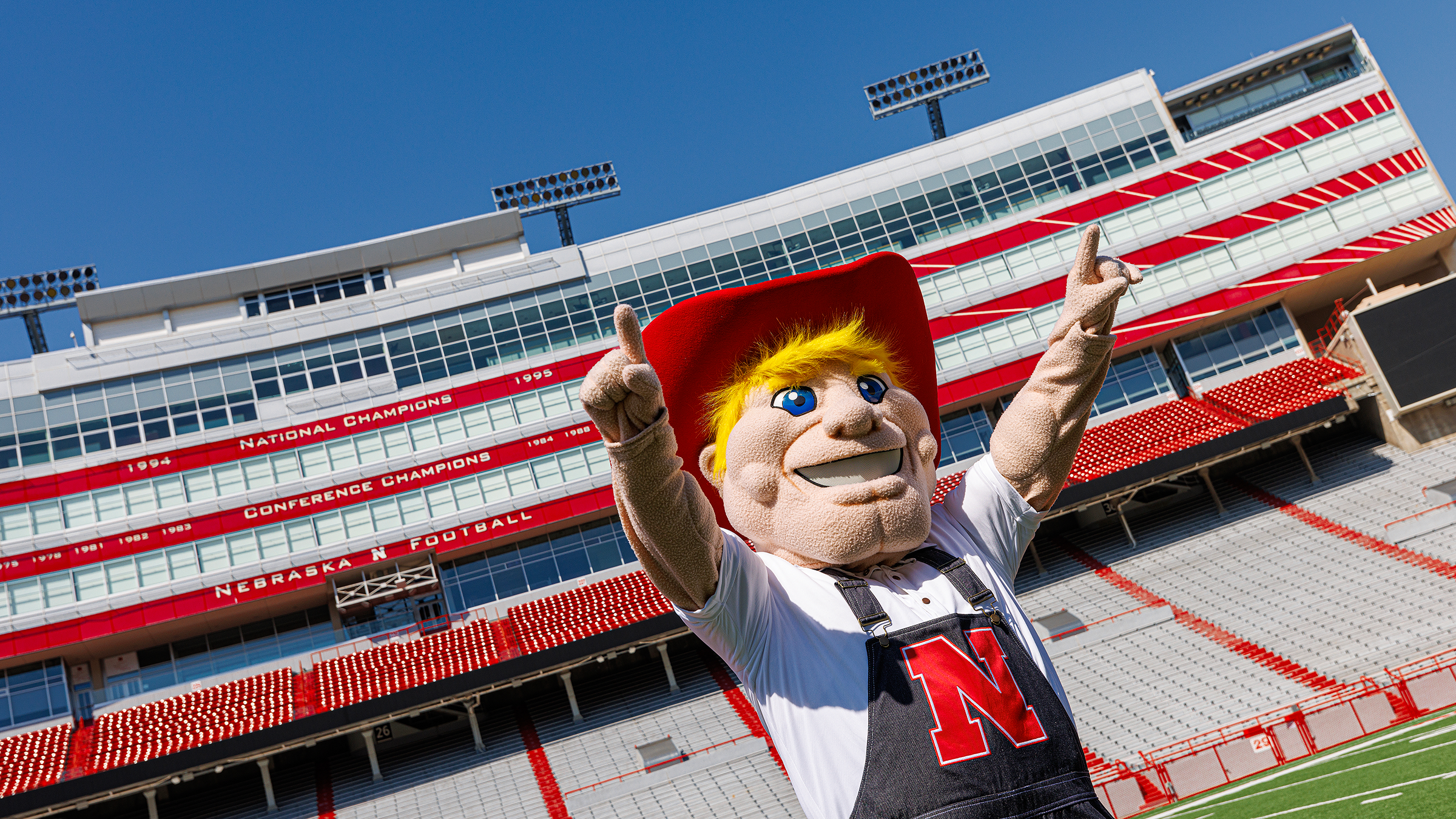 Herbie Husker Mascot standing in a stadium