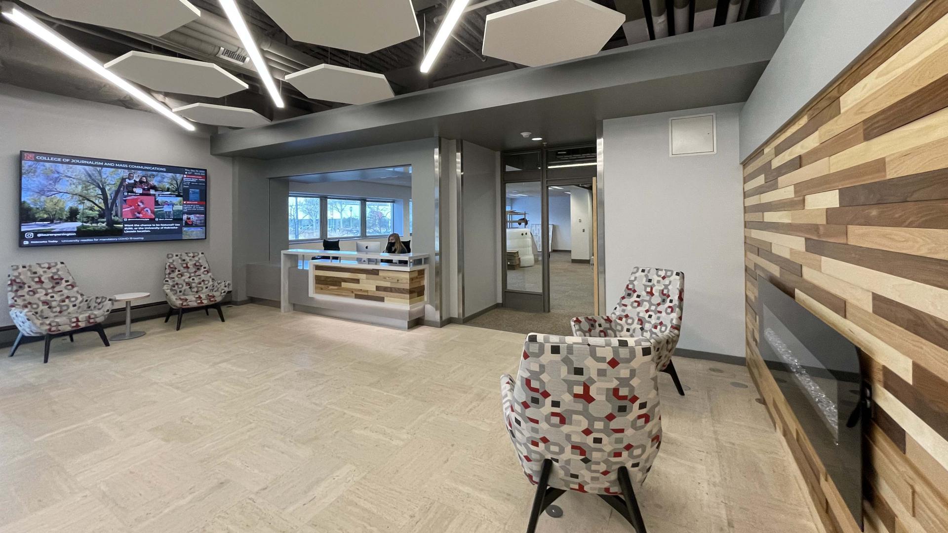 chairs and desk in a building lobby