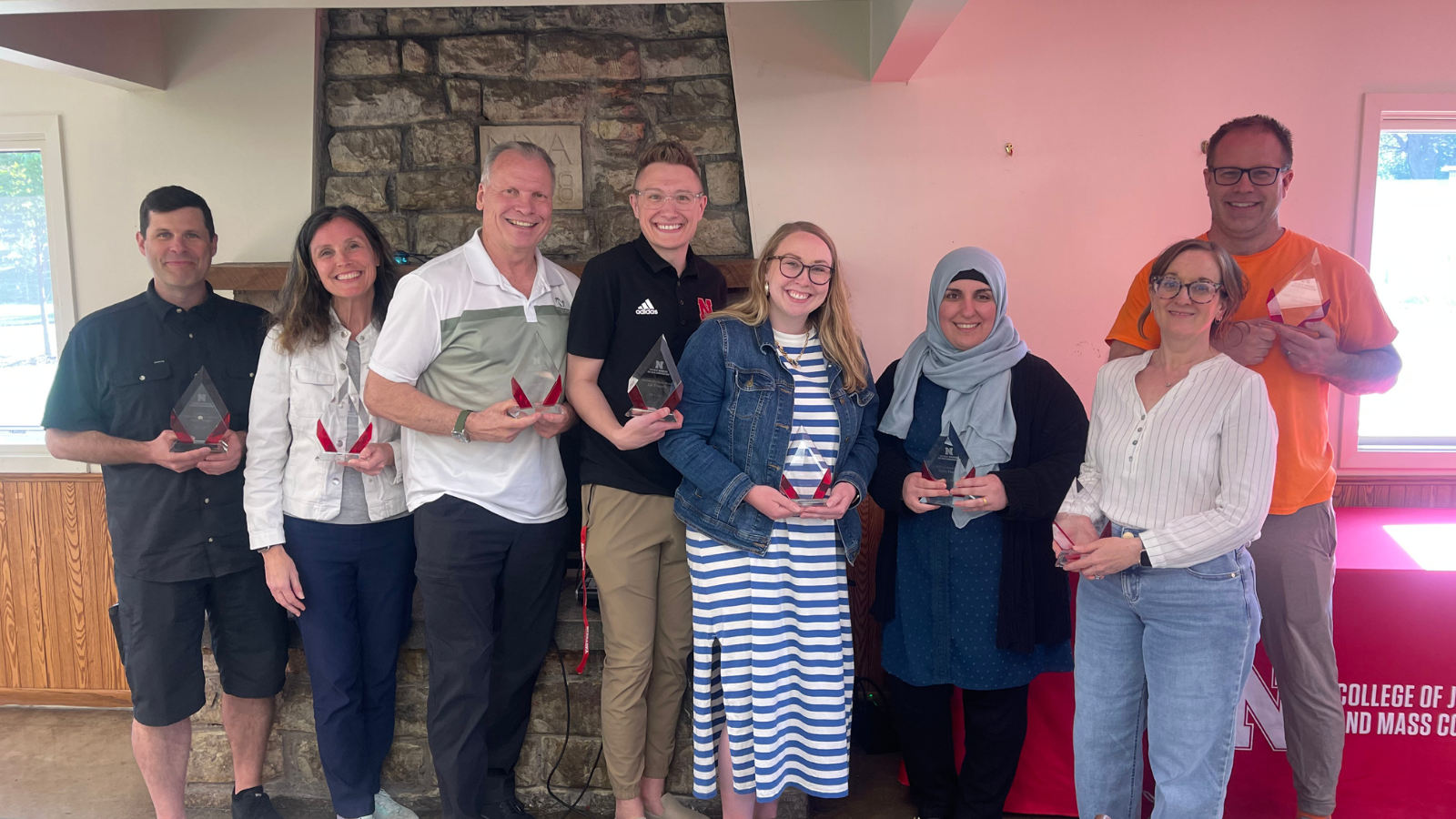 Faculty and staff accept awards at the CoJMC Family Reunion on May 7, 2025. From left: Adam Wagler, Betsy Emmons, Barney McCoy, Zac Franzen, Natalie Becerra, Karez Hassan, Jessica Walsh, Alan Eno