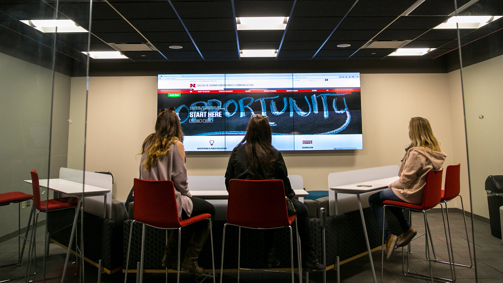 Students looking at a big screen