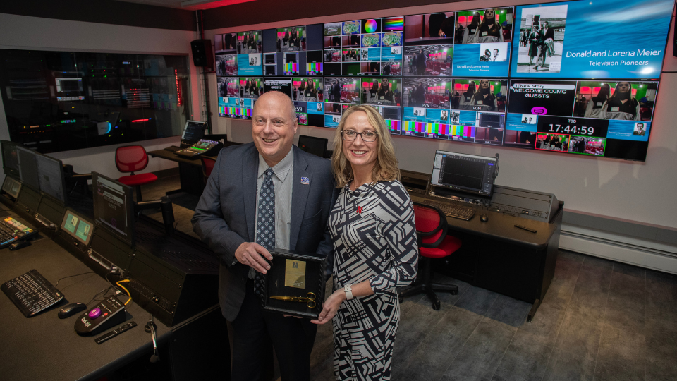 Dean Shari Veil and NBA president and executive director, Jim Timm in the Don and Lorena Meier Studio control room.