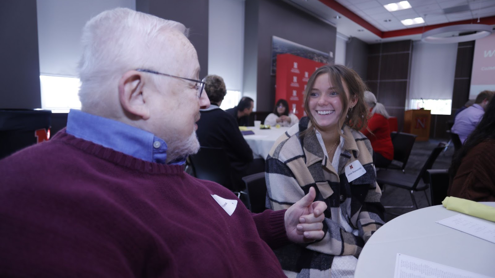 CoJMC Emeritus Professor Peter Mayeux, talks with Jenna Reynolds, sophomore broadcasting and advertising and public relations double major and 2022-2023 recipient of the Peter Mayeux scholarship during the CoJMC Scholarship Brunch on Oct. 8, 2022.