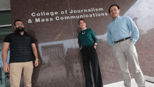 people in front of andersen hall sign