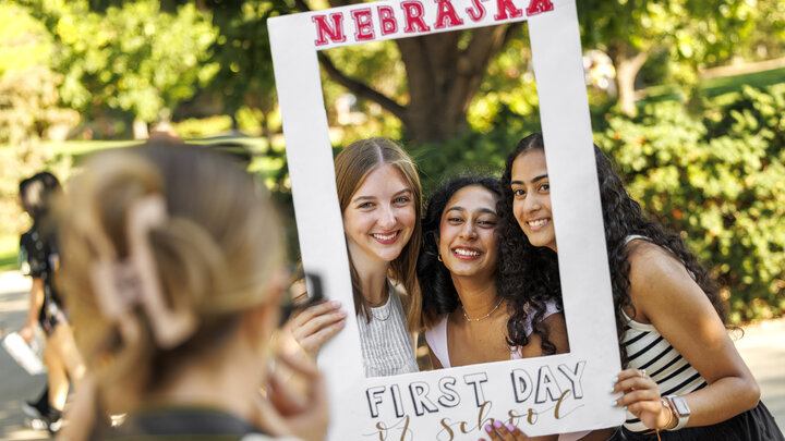 Freshman Makenna Jolley (left) and sophomores Anisha Patchipulusu (center) and Shayna John pose for a photo near the Nebraska Union on the first day of fall classes, Aug. 26.