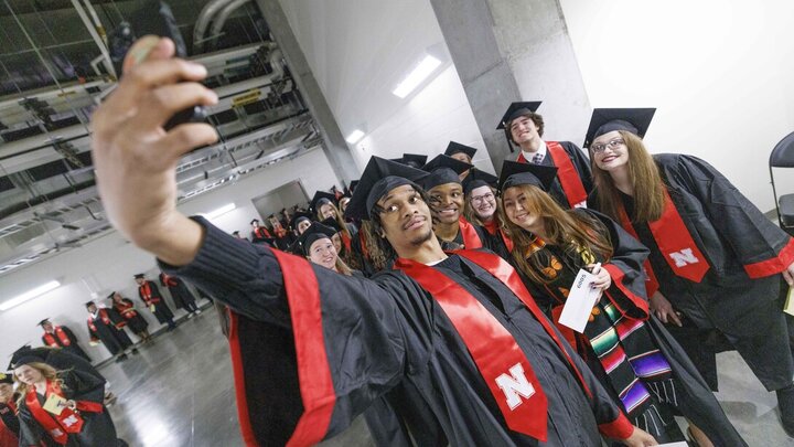 Cameron King of Omaha takes a selfie with his fellow College of Journalism and Mass Communications graduates before the undergraduate commencement ceremony Dec. 21 at Pinnacle Bank Arena. The university conferred 1,149 degrees to 1,132 graduates during ceremonies Dec. 20 and 21.