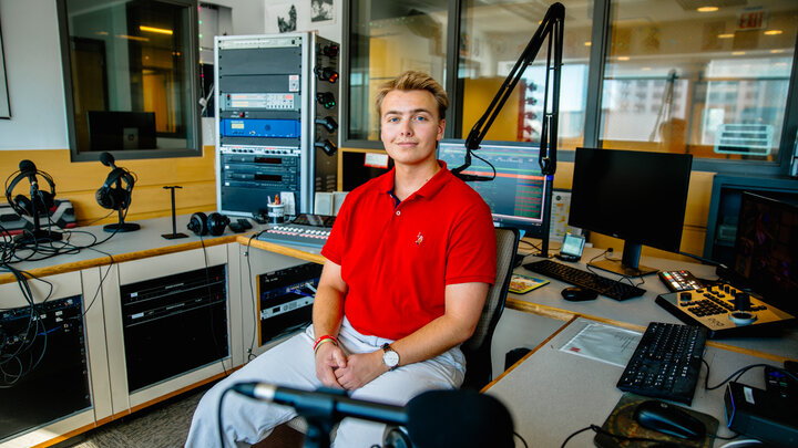 Schrantz, a junior sports media & communication and broadcasting double major from Orchard Park, NY, pictured here in the KRNU headquarters.