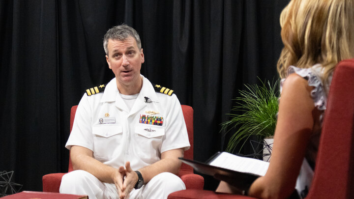 Navy officer talking to Dean Veil