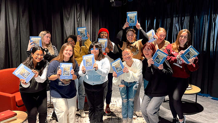 Students in the Nebraska Mosaic class pose with copies of World Citizen: Journeys of a Humanitarian gifts to them by Jane Olson. 