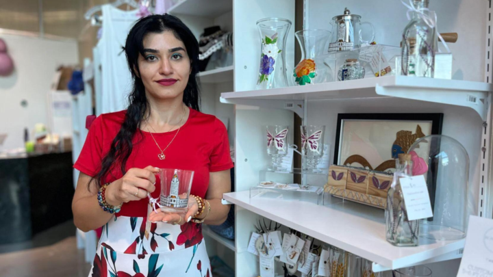 Iraqi refugee Alktra Farhan displays her artwork at The ECHO Shop on Monday, Sept. 9, 2024, in Lincoln, Nebraska. Farhan left Iraq in 2006 after her family deemed it too dangerous to continue living there. She arrived in the U.S. in 2010 after the UN Refugee Agency accepted her family’s application.