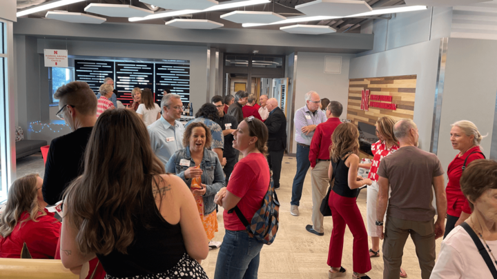 alumni gather in the Andersen Hall lobby