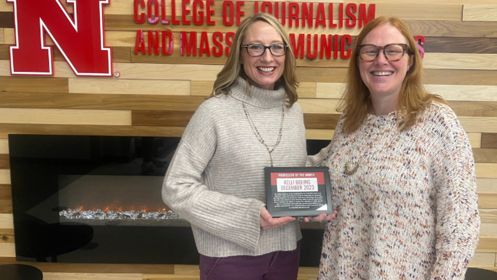 Dean Shari Veil (left) presents the December Professor of the Month Award to Assistant Professor Kelli Boling on Jan. 24. 