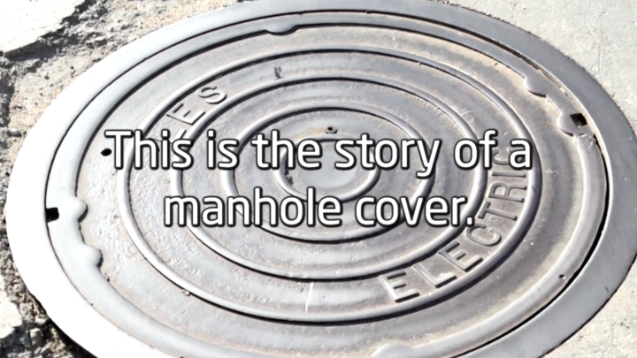 Image of manhole cover with text over it