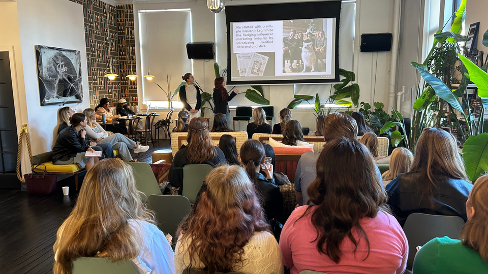 Students listen to a presentation at influencer marketing firm, Fohr.
