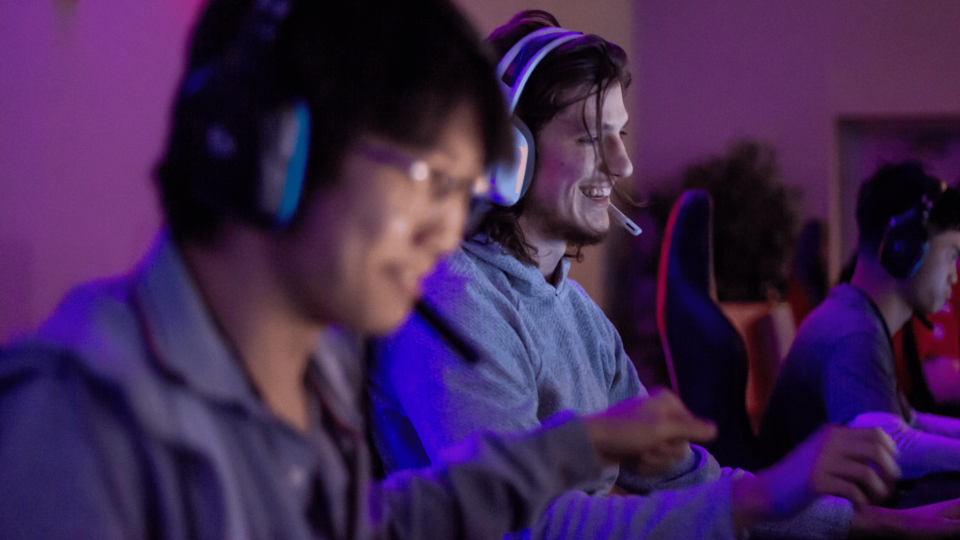 Two men wear headsets