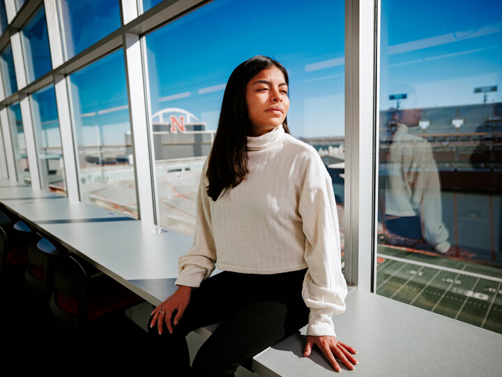 Photo Credit: Craig Chandler // Marissa Kraus looks across Tom Osborne Field from the media box in Memorial Stadium