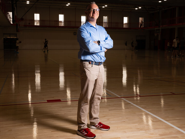 A man stands on a basketball court.