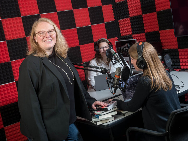 Kelli Boling is photographed in the podcast studio in the College of Journalism and Mass Communications.