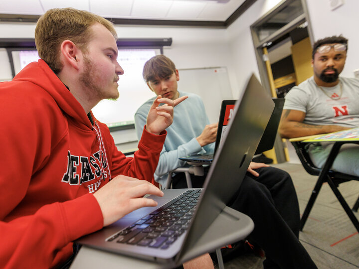 College of Journalism students talk in class