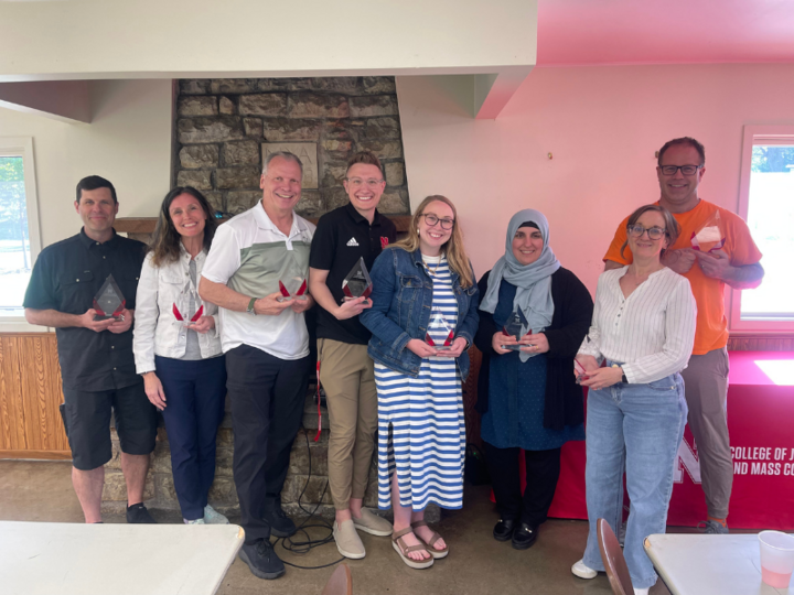 Faculty and staff accept awards at the CoJMC Family Reunion on May 7, 2025. From left: Adam Wagler, Betsy Emmons, Barney McCoy, Zac Franzen, Natalie Becerra, Karez Hassan, Jessica Walsh, Alan Eno