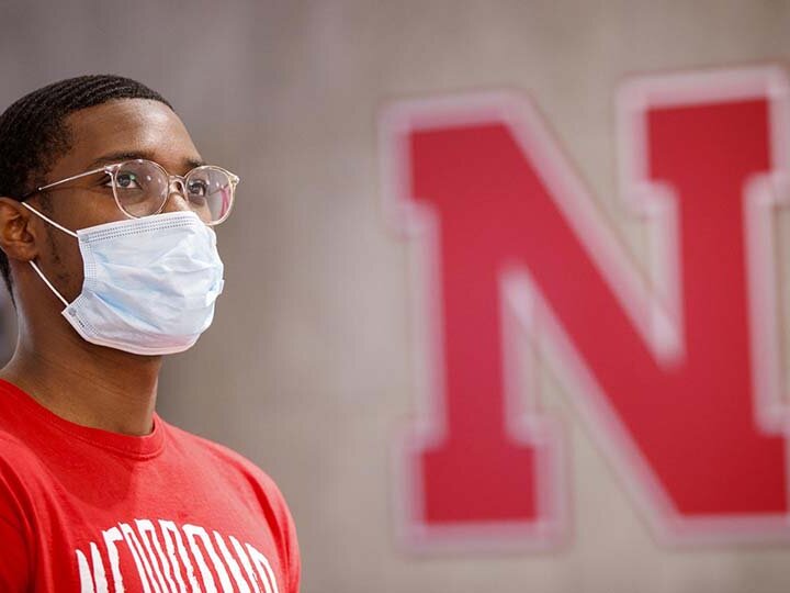 Student looking to the right wearing a facemask