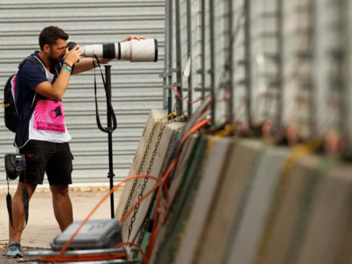 a sports photographer shooting an image