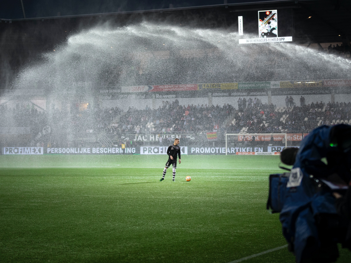 Telivision sports reporting a soccer game