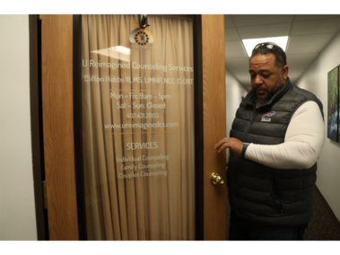 1.	Pastor Clifton Hobbs checks his watch before entering his office at U Reimagined Counseling services in Lincoln, Neb., on February 21, 2026.