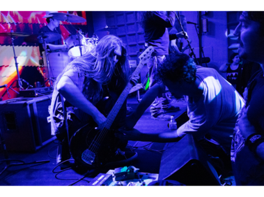 Fan plays bass with Phuzz Benjamin Shellhaas, of Lincoln, plays bass on stage with Phuzz while a fan tries to play with him at the Music Box on Saturday, Feb. 21, 2026, in Lincoln, Nebraska. Phuzz is a stoner metal band that has been active in the music scene since 2024. (