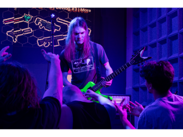 Fans praise Phuzz’s guitarist for riffs Giovanni Nahorny, of Lincoln, plays guitar on stage with Phuzz at the Music Box on Saturday, Feb. 21, 2026, in Lincoln, Nebraska. When Nahorny plays a riff on stage, the crowd waves in his direction to praise his performance. (Photo by Alex Gryczanowski / UNL College of Journalism and 
