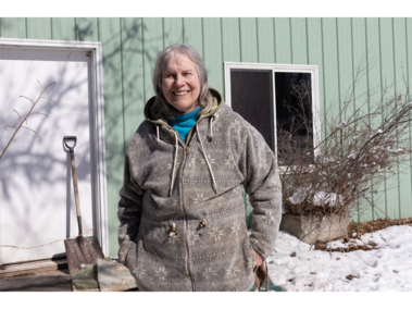Betsy Finch, 79, from Elmwood, Nebraska, the director of Raptor Conservation Alliance in Elmwood, Nebraska poses for a portrait in front of the main building of the Raptor Conservation Alliance on Saturday, February 21, 2026, in Elmwood, Nebraska. Betsy Finch helped start the Raptor Conservation Alliance 50 years ago and has helped save over 15,000 raptors in those years. (Photo by Makayla Maxson)