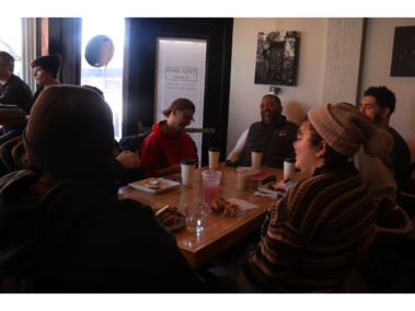 7.	Clifton Hobbs, Brandi Hobbs, Caleb Hobbs, Shaylee Hobbs, Shane Daughtrey, Gabby Madera and Andrea Minter have a conversation at Mo Java Coffee shop on Feb. 21, 2026. Clifton’s favorite way to practice his faith is by connecting with younger people. “I enjoy this more than I do church,” Clifton Hobbs said. (Photo by Amanda Yuan)