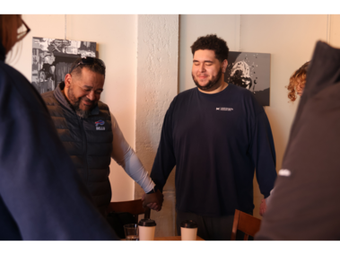 8.	Clifton Hobbs, Caleb Hobbs and Shaylee Hobbs lock hands in prayer at Mo Java Coffee Shop on Feb. 21, 2026. After several hours of conversation, the group ends their meeting with their usual routine. 