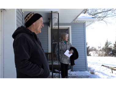 Betsy Finch, 79, from Elmwood Nebraska and Doug Finch, 67, from Elmwood Nebraska stand on the porch of their house that is located on the Raptor Conservation Alliance property so the couple can ensure the birds on their property are cared for at all times on Saturday, February 21, 2026, in Elmwood, Nebraska. (Photo by Makayla Maxson)
