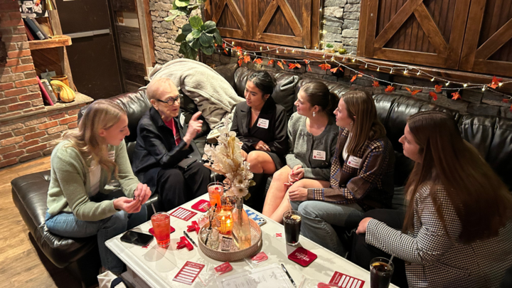 Media tour students connecting with alumna Mary Lou Luther during the NYC Connections event.