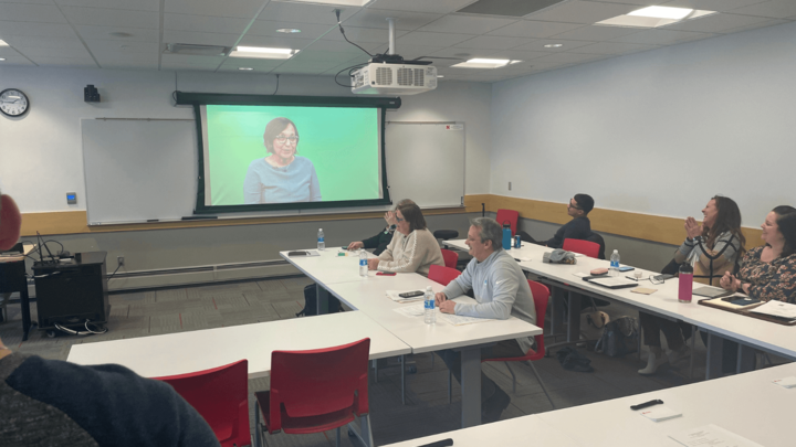 people looking at a screen in a classroom