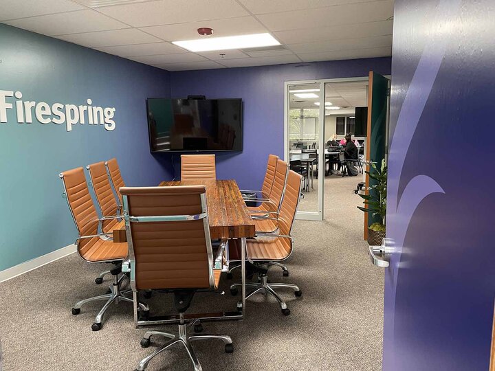 picture of a conference room painted in purple and teal