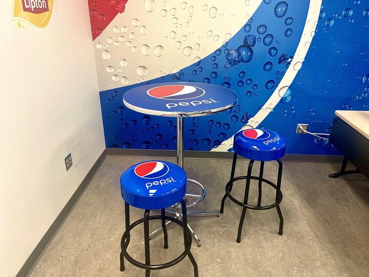 two Pepsi-themed stools and table for the lab