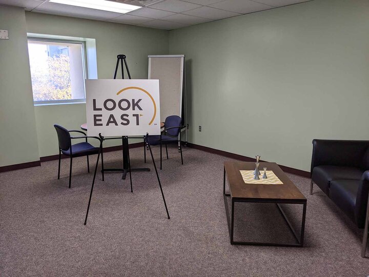 office with a sign on an easle that reads "LookEast"