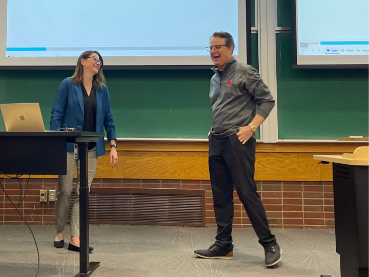 Professor and William H. Kearns Chair in Journalism Frauke Hachtmann (left) and Charlie Arnot share a laugh after Arnot's presentation in Hachtmann's Introduction to Advertising and Public Relations course.